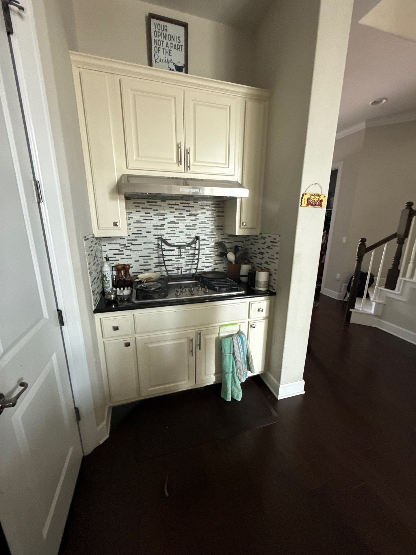 Kitchen cabinets and range area ahead of refinishing