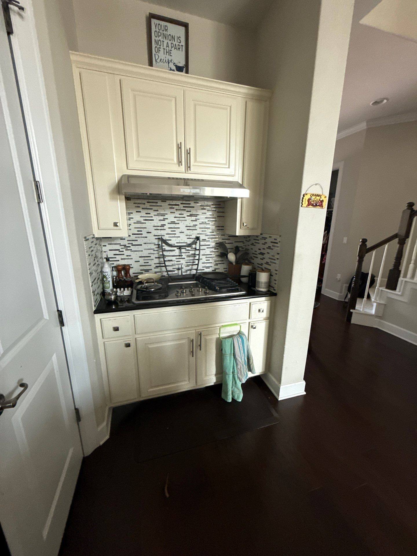 Kitchen cabinets and range area ahead of refinishing