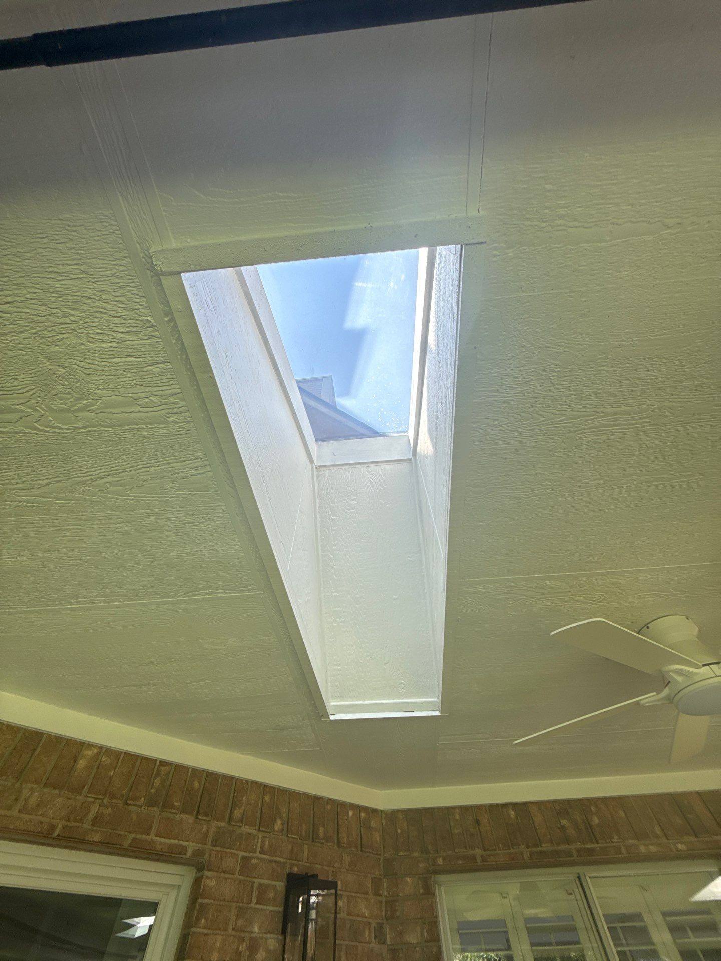 Covered porch ceiling and skylight area ahead of painting