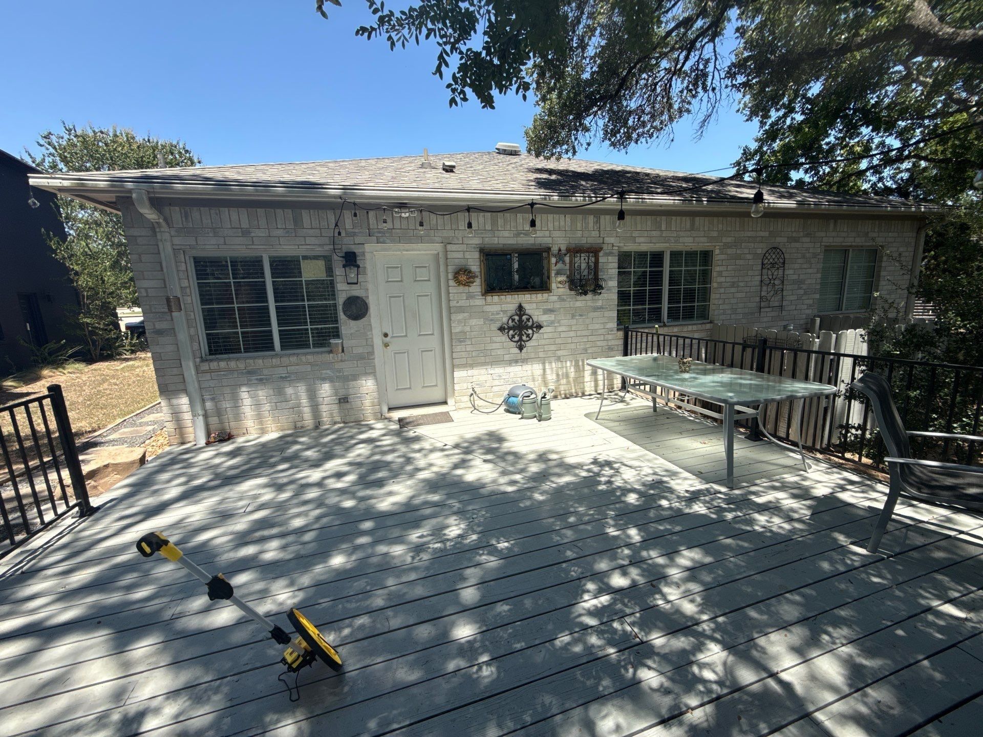 Back exterior and deck area of the home