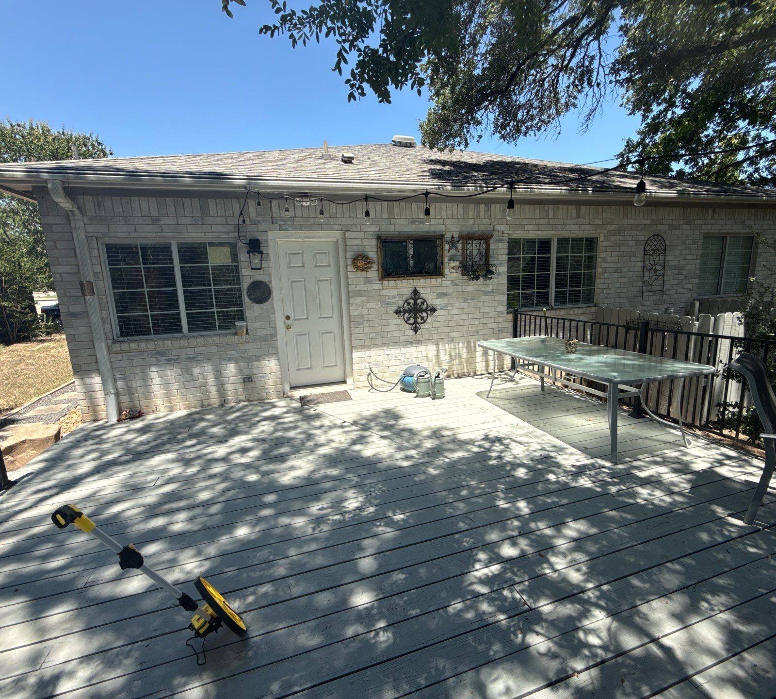 Back exterior and deck area of the home