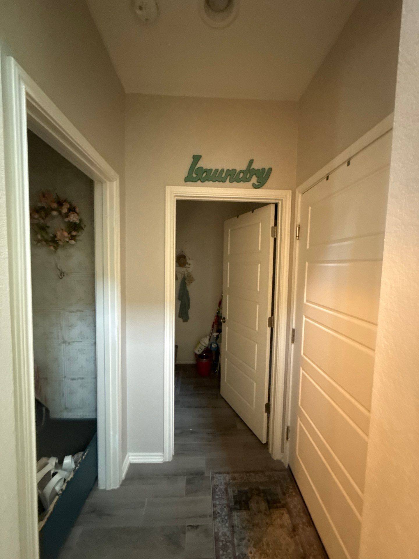 Laundry area hallway ahead of painting