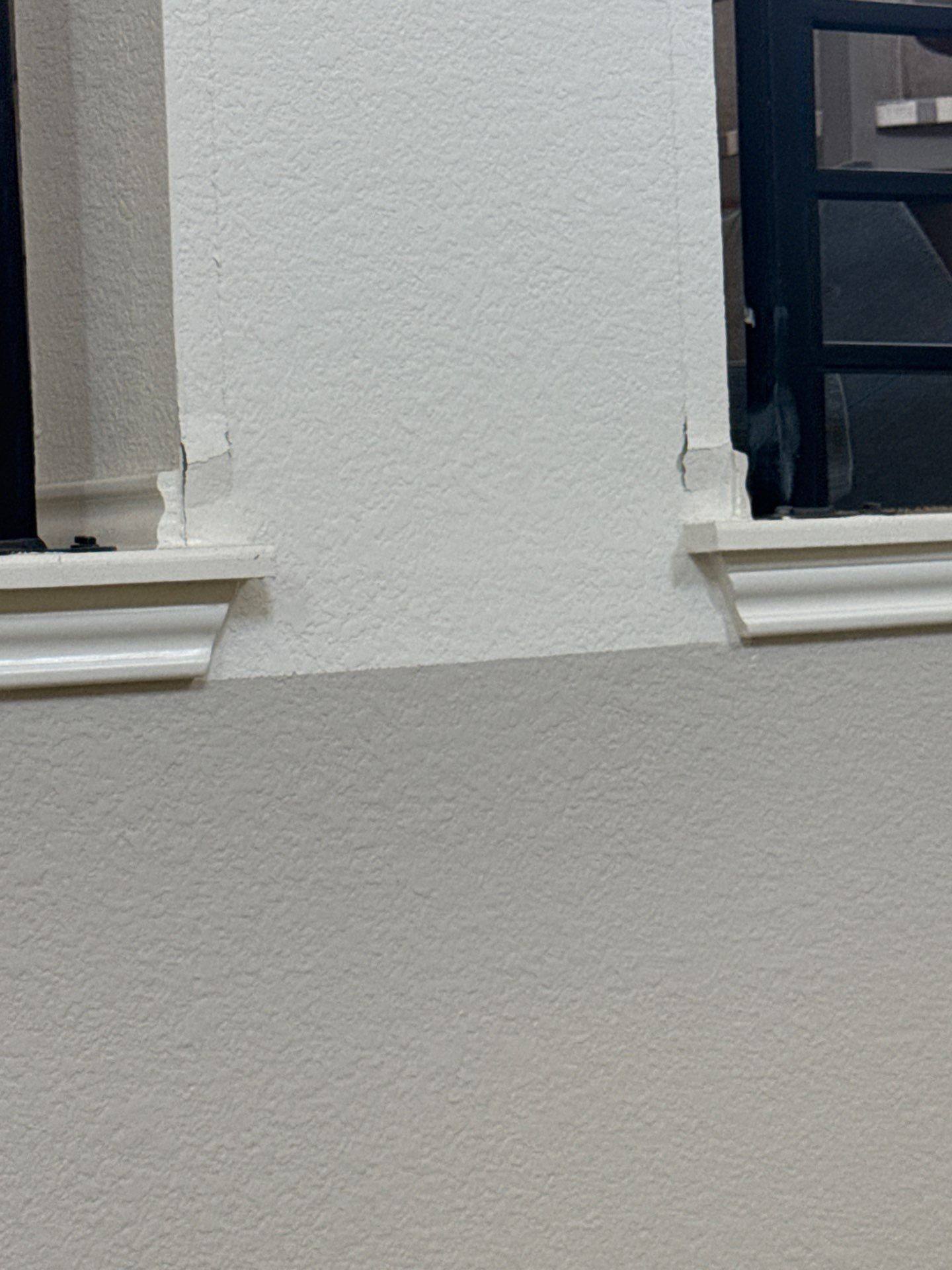 Wall repair between two banisters in the stairwell