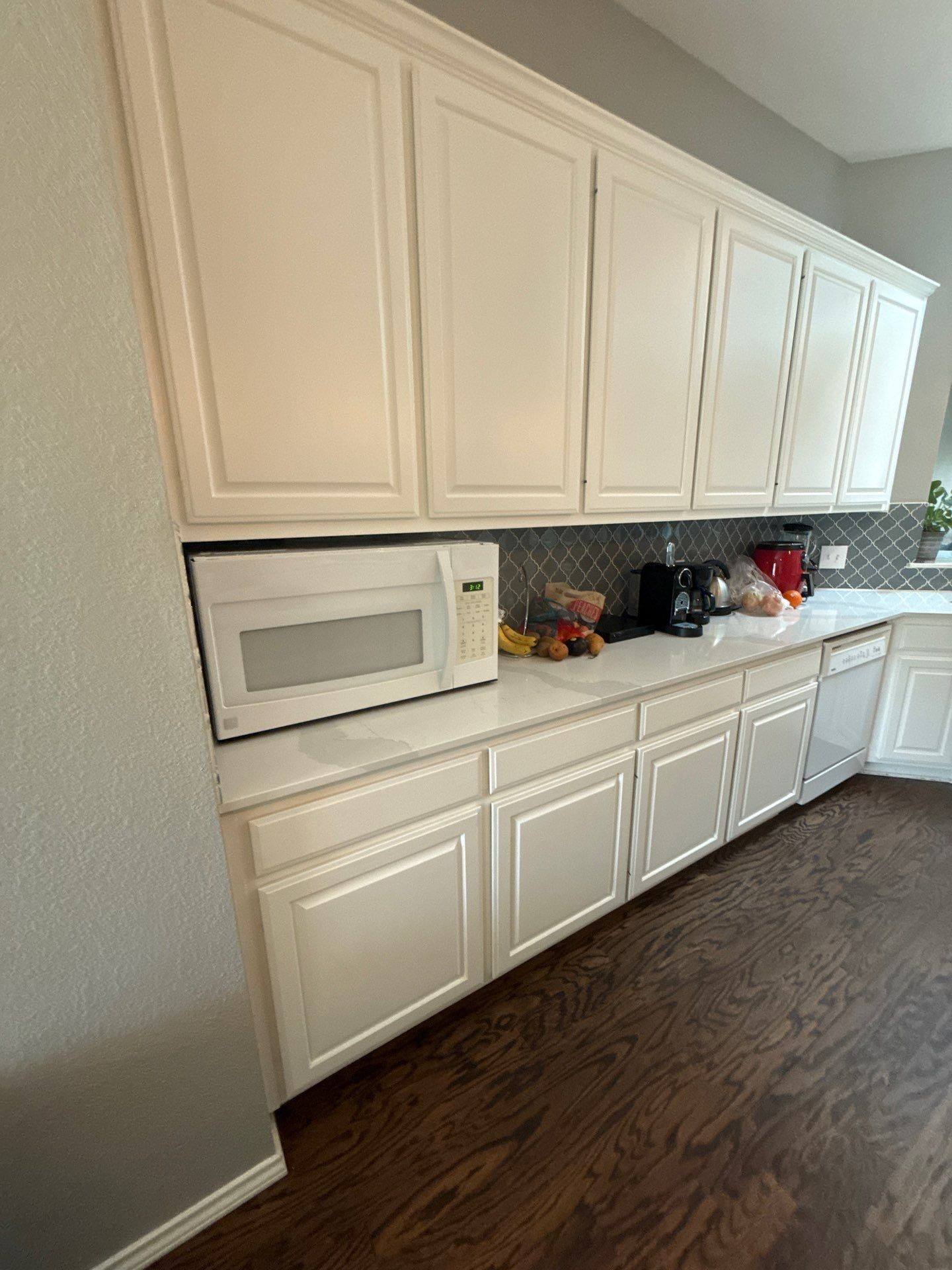 Kitchen upper cabinets and counter ahead of refinishing