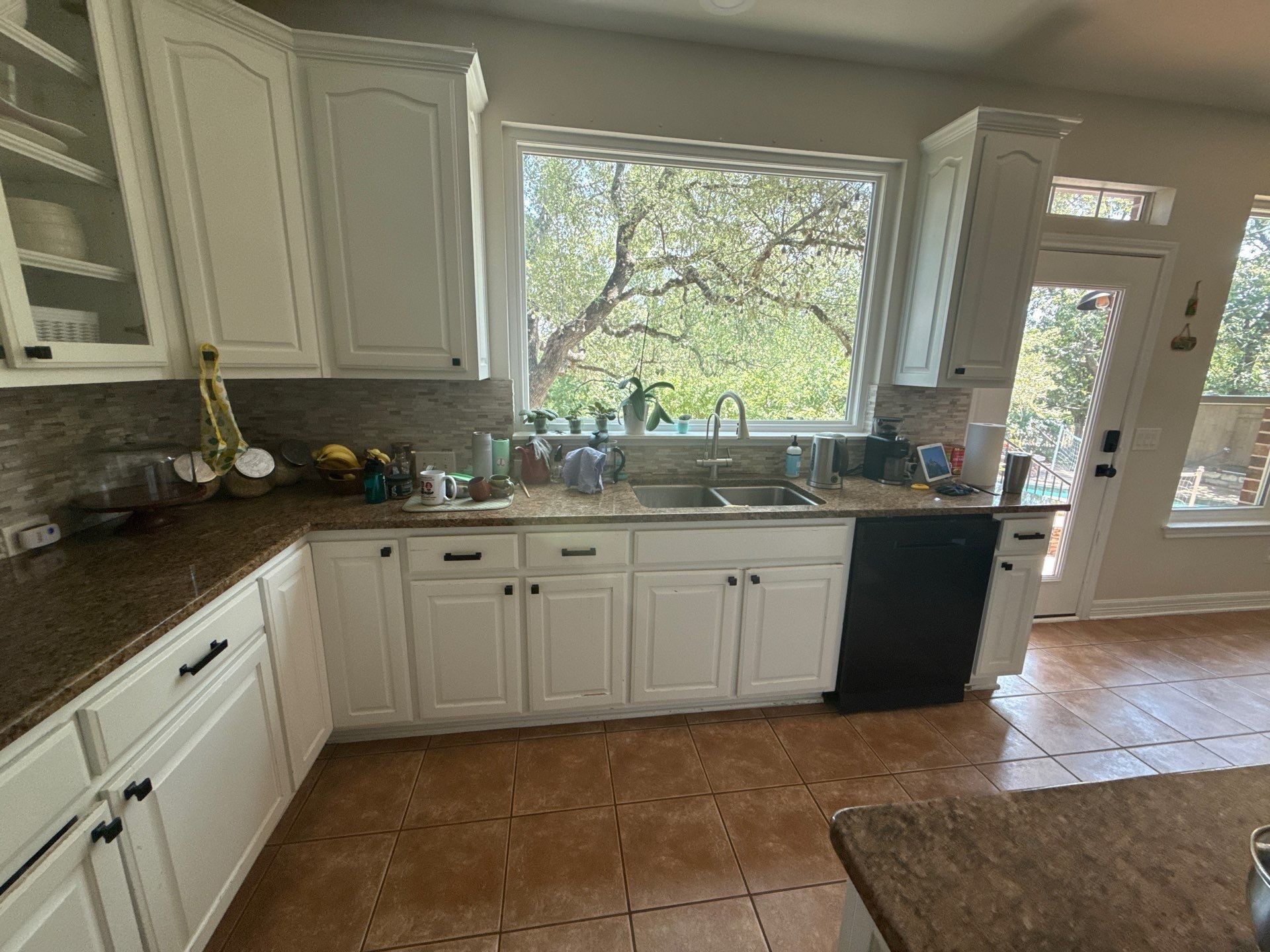 Kitchen sink and counter area ahead of cabinet refinishing