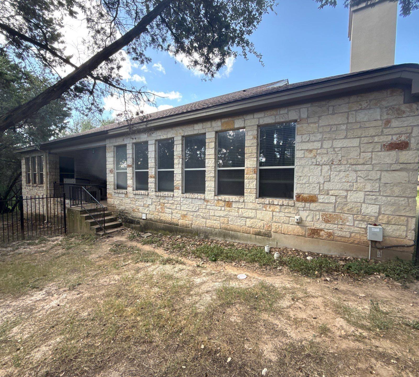 Side exterior with windows and chimney