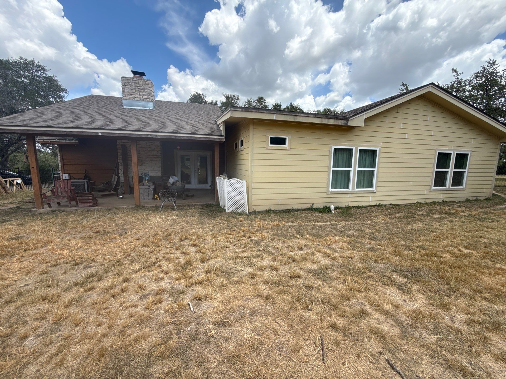 Back exterior with chimney and siding