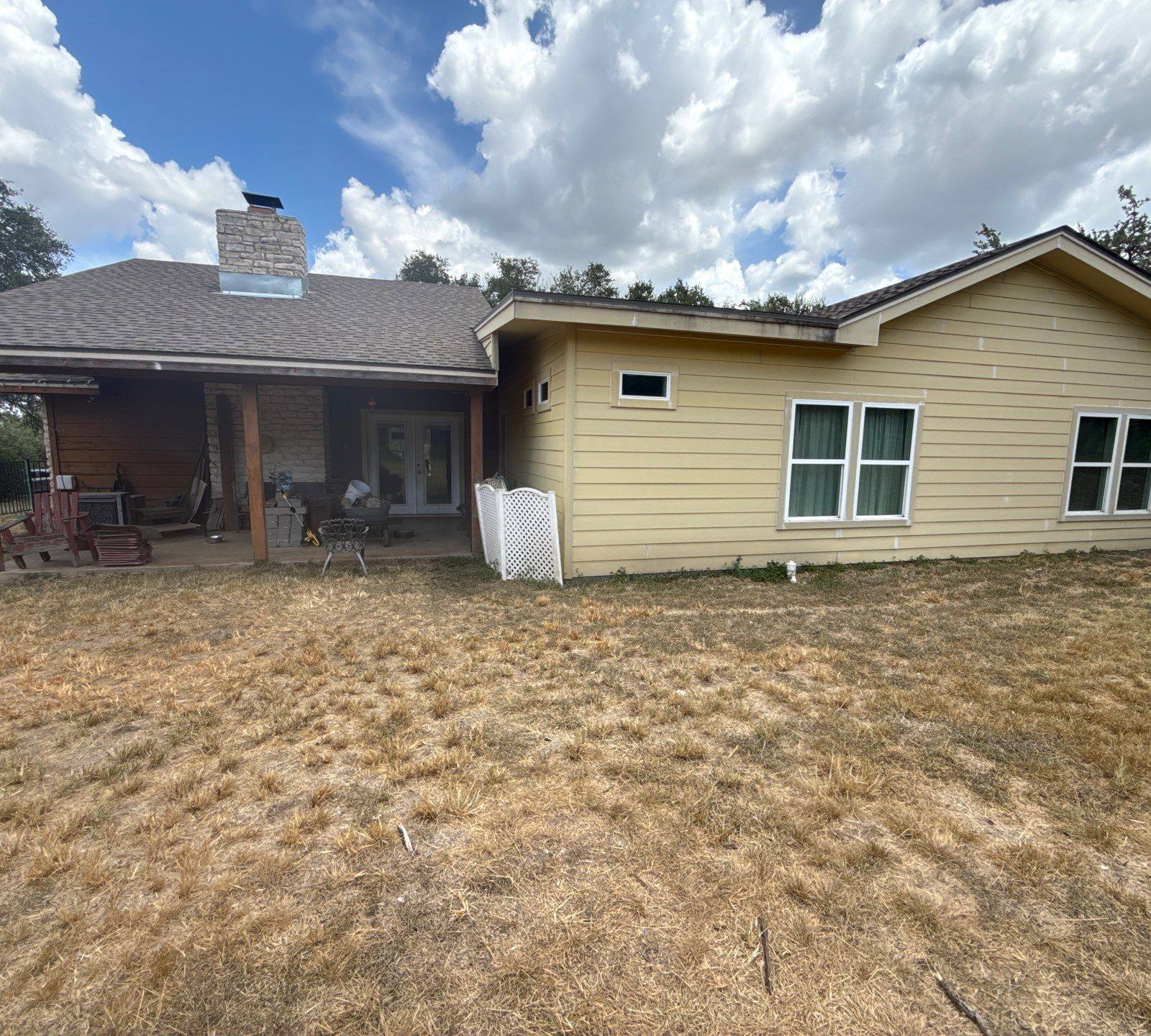 Back exterior with chimney and siding