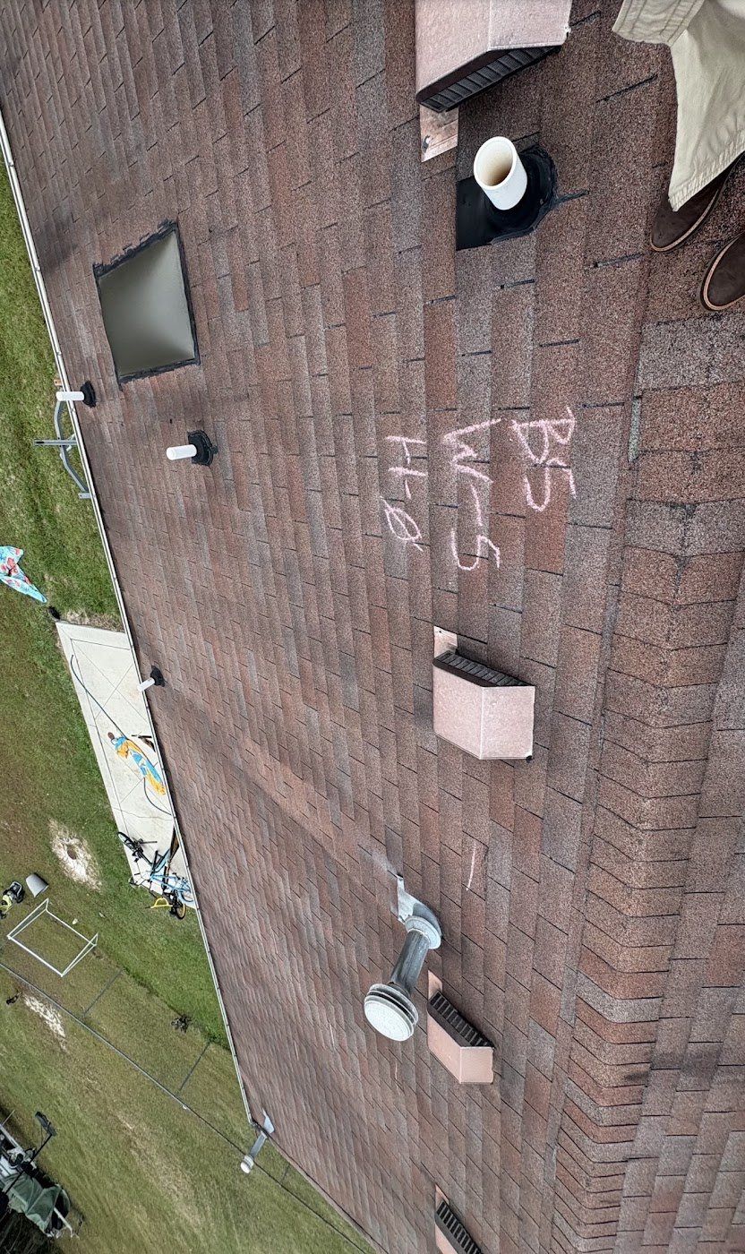 Hail-damaged roof on a KCC job still carrying the adjuster's chalk test squares