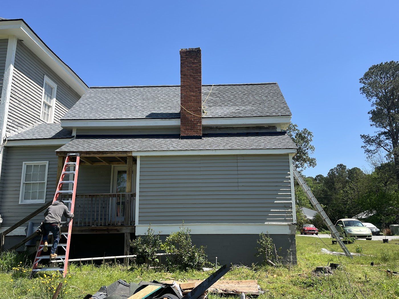 Completed exterior elevation with new siding, trim and roofing by Kingdom Craft Construction