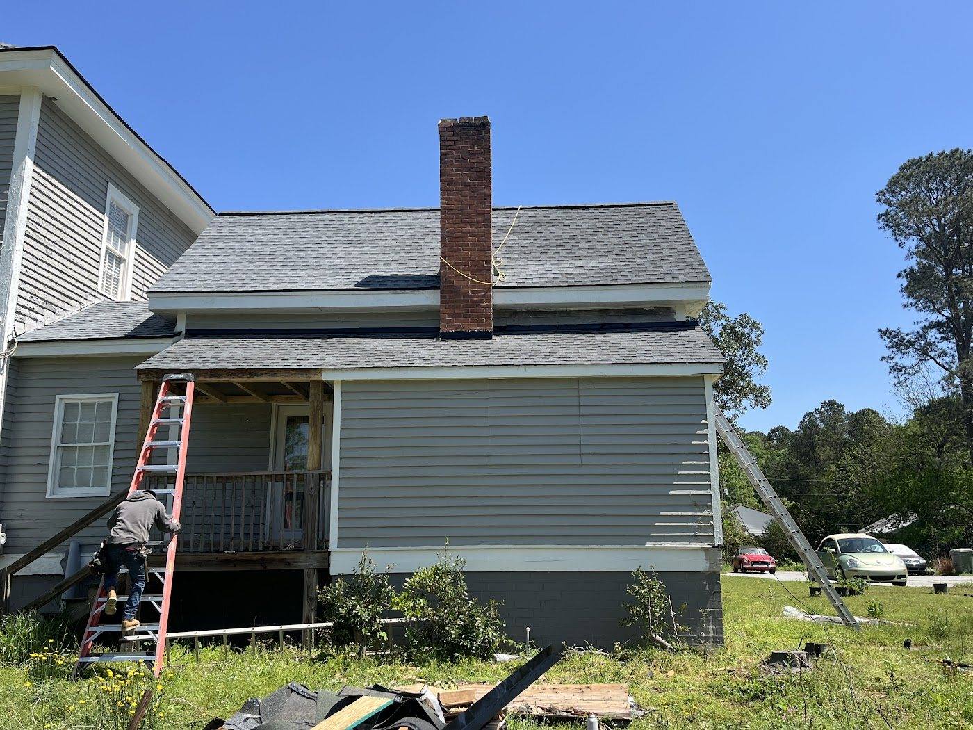 Completed exterior elevation with new siding, trim and roofing by Kingdom Craft Construction